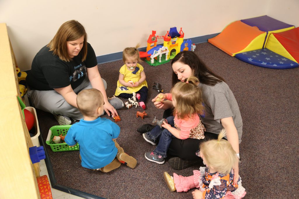 childcare providers and kids in group setting